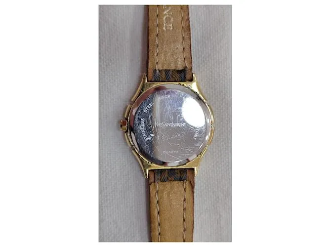 Yves Saint Laurent Relojes finos Dorado 